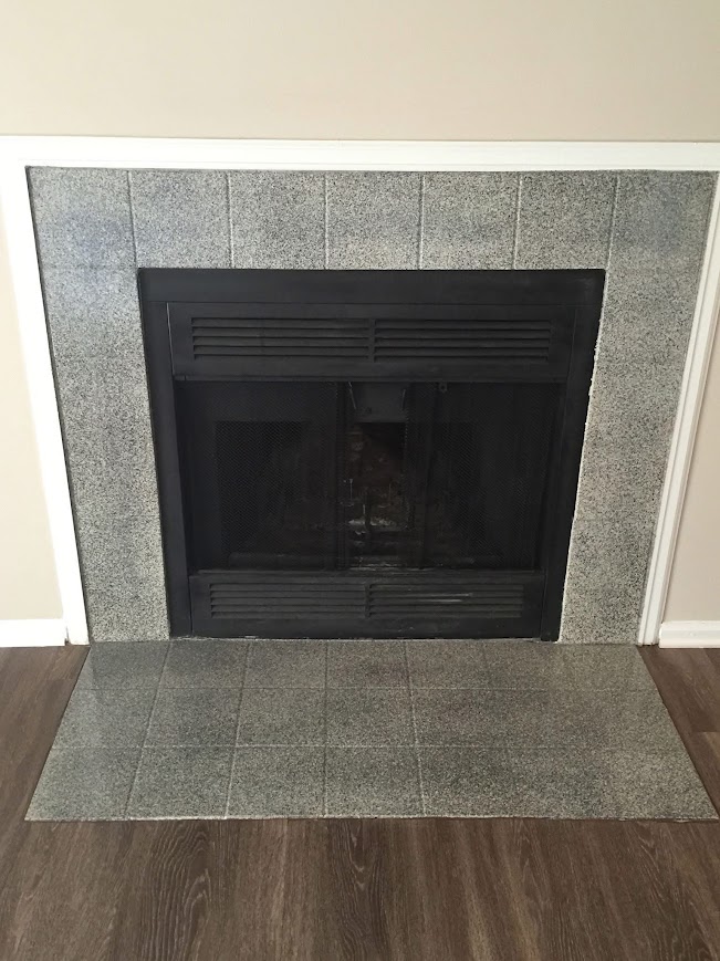 Stone-look granite finish fireplace after ANEW refinishing